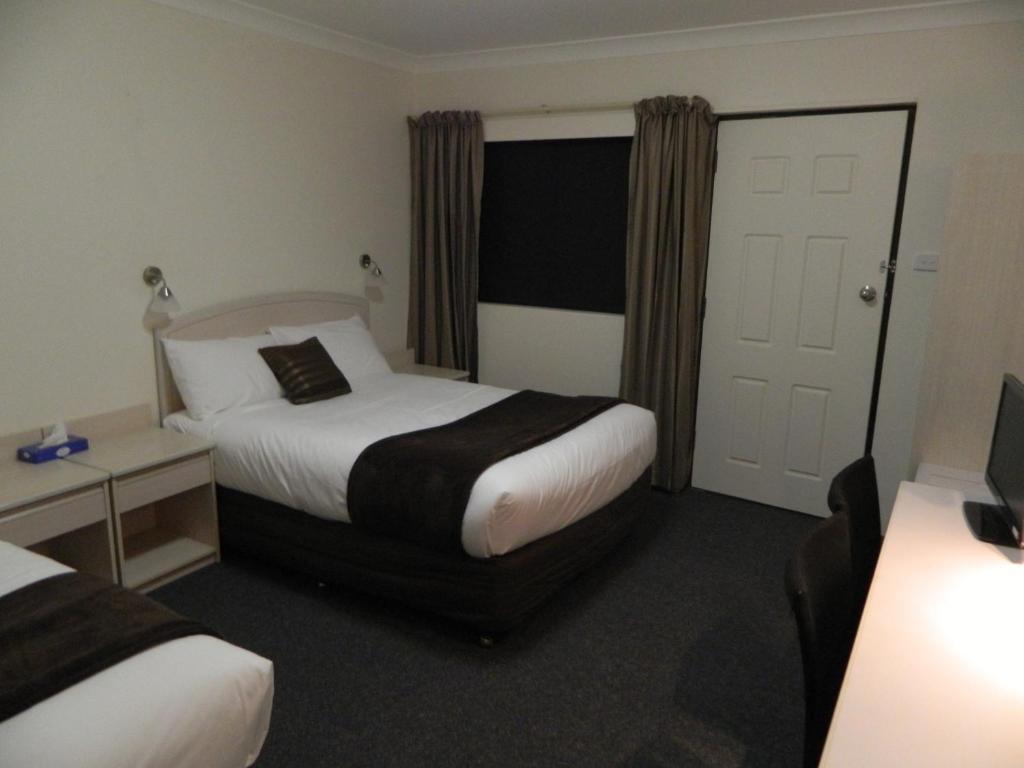 Alabaster Motor Inn Тарий Стая снимка
